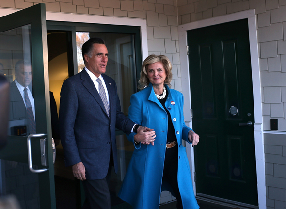 Republican presidential candidate, former Massachusetts Gov. Mitt Romney (L) and his wife Ann Romney emerge from the Beech Street Center after casting their ballots at on November 6, 2012 in Belmont, Massachusetts. The race for the presidency remains tight as Americans are heading to the polls to cast their ballots.