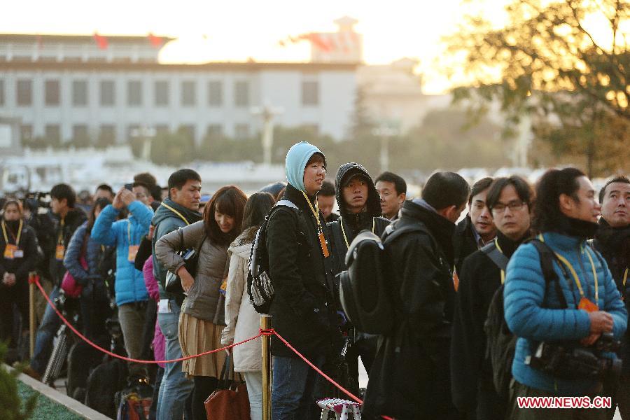 Journalists wait outside the Great Hall of the People, the venue of the opening ceremony of the 18th National Congress of the Communist Party of China (CPC), at the Tian&apos;anmen Square in Beijing, capital of China, Nov. 8, 2012. The 18th CPC National Congress opened in Beijing on Thursday, which also marks the 12th Journalists&apos; Day of China. A total of 2,732 Chinese and foreign journalists are involved in the coverage of the 18th CPC National Congress. (Xinhua/Jin Liwang) 