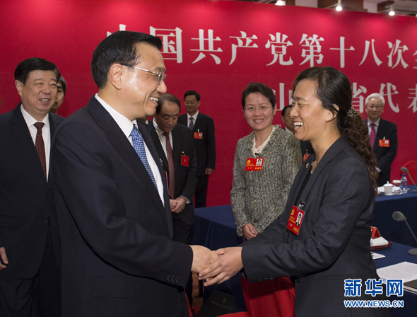 Li Keqiang joins a panel discussion with delegates from Shandong Province on Hu Jintao's report delivered to the 18th National Congress of the Communist Party of China (CPC), which opened Thursday morning in Beijing.