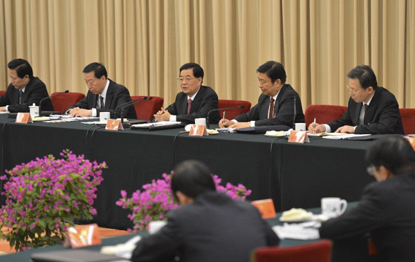 Chinese President Hu Jintao (C), also general secretary of the Central Committee of the Communist Party of China (CPC), joins a panel discussion of the Jiangsu delegation to the 18th National Congress of the Communist Party of China (CPC) in Beijing, capital of China, Nov. 9, 2012.[Photo/Xinhua]