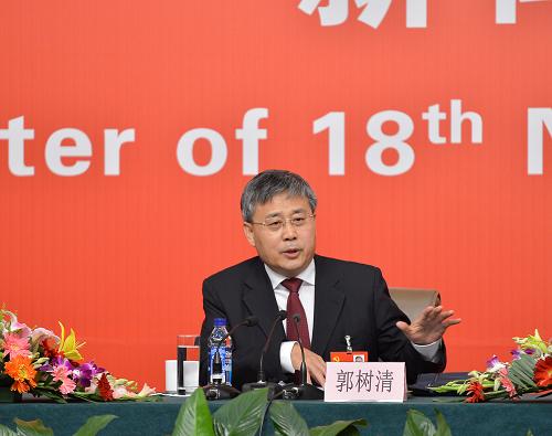 Guo Shuqing, chairman of the China Securities Regulatory Commission (CSRC), at a group interview. [Xinhua]
