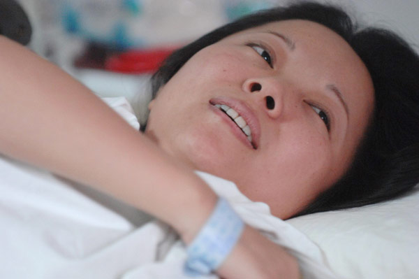 Wu Juping recovers in a hospital bed in Fuyang city, Zhejiang province, July 13, 2011.[Photo/Xinhua]