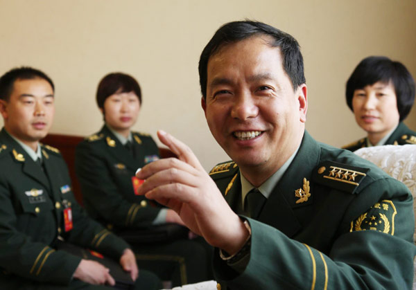 Ding Xiaobing, political commissar of an armed police division, takes part in a panel discussion at the 18th CPC National Congress in Beijing.[Photo/Xinhua]