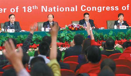 From left, four grassroots delegates to the Party Congress, Wang Xi, Ju Xiaolin, Ting Bateer and Yang Ruihui, address a news conference on Monday. [Photo / China Daily]