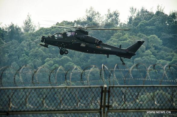 A WZ-10 attack helicopter conducts low-altitude adaptive flying exercise in Zhuhai, Guangdong Province, Nov. 11, 2012. 