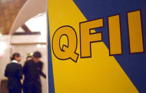 An advertisement on QFII in Shanghai, on Sept 4, 2005. China granted US$2.75 billion in quotas - a single-month record - to foreign investors in October. [File Photo] 