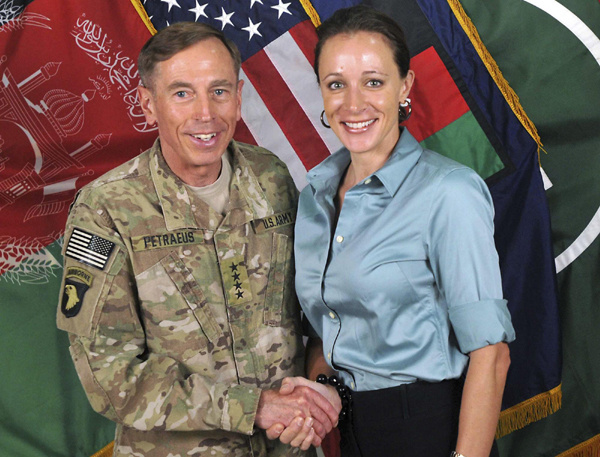 Commander of the International Security Assistance Force/US Forces in Afghanistan General David Petraeus shakes hands with author Paula Broadwell in this ISAF handout photo originally posted July 13, 2011. [Agencies] 