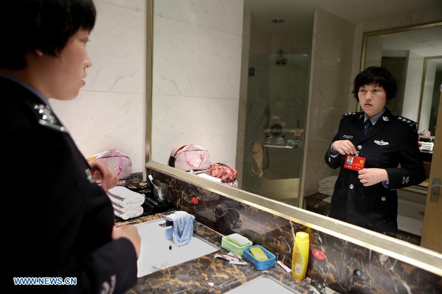 Jiang Min, a delegate to the 18th National Congress of the Communist Party of China (CPC), makes preparation for the meeting in the afternoon in Beijing, capital of China, Nov. 13, 2012. 