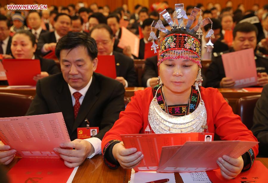 Delegates watch their ballots during the closing session of the 18th National Congress of the Communist Party of China (CPC) at the Great Hall of the People in Beijing, capital of China, Nov. 14, 2012. (Xinhua/Chen Jianli) 