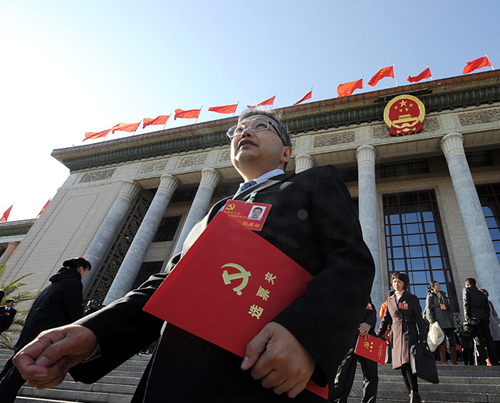 Delegates leave after the closing session of the 18th National Congress of the Communist Party of China (CPC) at the Great Hall of the People in Beijing, capital of China, Nov. 14, 2012. [Xinhua Photo]