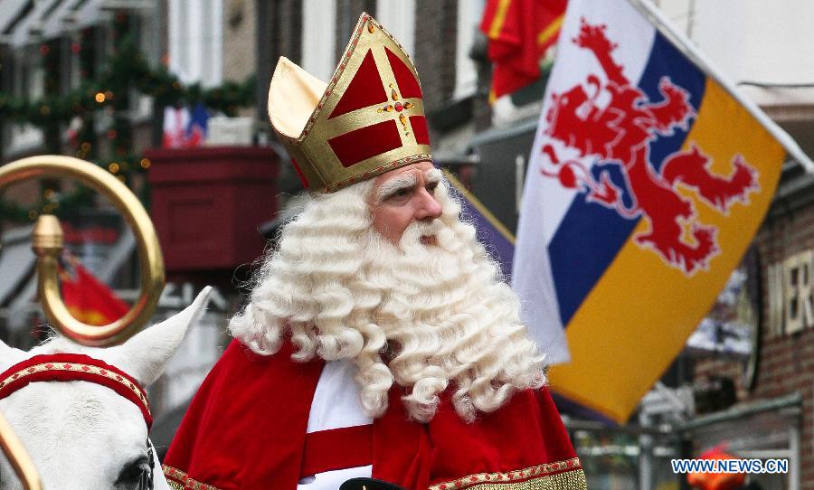 Sinterklass, the character of Santa Claus, appears on the street during a celebration to welcome him in Roermond, the Netherlands, Nov. 17, 2012.