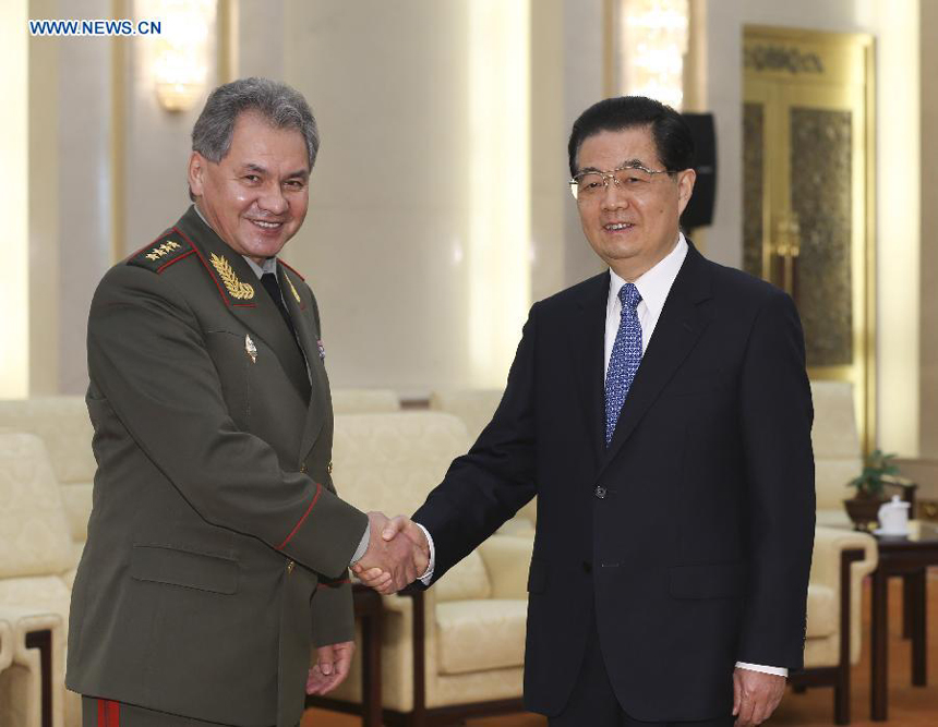 Chinese President Hu Jintao (R, front) meets with Russian Defense Minister Sergei Shoigu (L, front) in Beijing, capital of China, Nov. 21, 2012. 