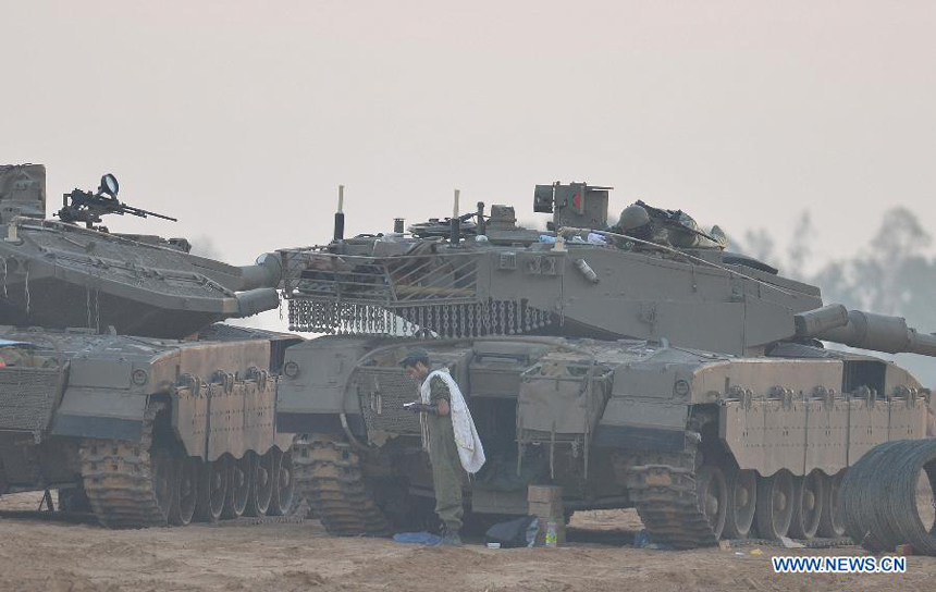 Israeli ground troops are seen stationed at an Israeli army deployment area near the Israel-Gaza Strip border on Nov. 21, 2012. The Israeli Prime Minister&apos;s Office confirmed on Wednesday evening that a ceasefire agreement has been reached with the Palestinian militant groups in Gaza. 