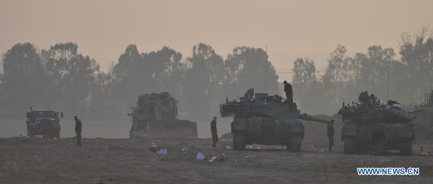 Israeli ground troops are seen stationed at an Israeli army deployment area near the Israel-Gaza Strip border on Nov. 21, 2012. The Israeli Prime Minister&apos;s Office confirmed on Wednesday evening that a ceasefire agreement has been reached with the Palestinian militant groups in Gaza. 