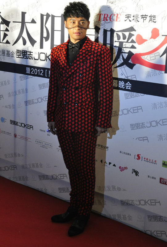 Singer-actor Banny Chen poses for photos at a charity auction held at the National Aquatics Center, also known as the Water Cube, on Nov. 22.