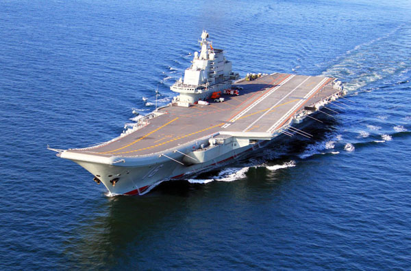 China's first aircraft carrier, the Liaoning, sails on the sea. China has conducted flight landing on its first aircraft carrier. [Photo/Xinhua]