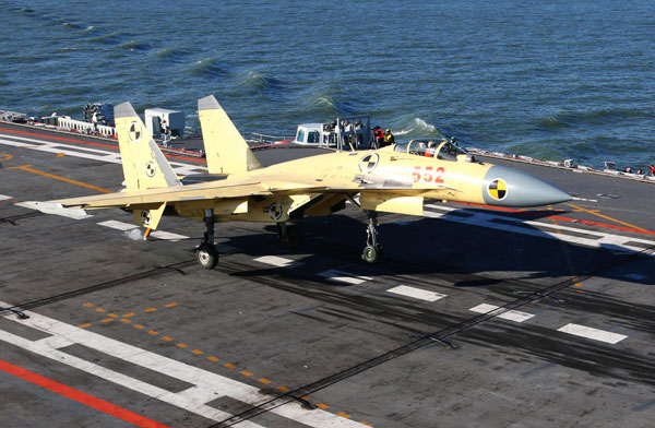 A carrier-borne J-15 fighter jet lands on China's first aircraft carrier, the Liaoning. [Photo/Xinhua]