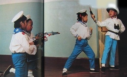 Four children pose during a play rehearsal.