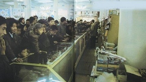 Customers are looking at items on display in counters at the New China Children's Store.