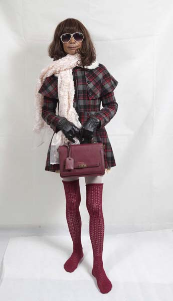 72-year-old Liu Qianping, also known as 'MaDiGaGa', poses for a modelling shoot in the southern Chinese city of Guangzhou Nov 24, 2012. [Photo/China Daily via Agencies] 