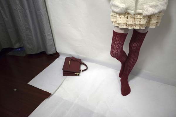 72-year-old Liu Qianping, also known as 'MaDiGaGa', poses for a modelling shoot in the southern Chinese city of Guangzhou Nov 24, 2012. [Photo/China Daily via Agencies] 