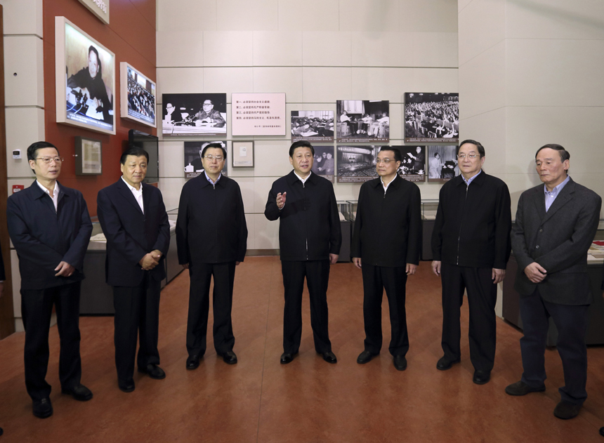 Xi Jinping (C), general secretary of the Communist Party of China (CPC) Central Committee and chairman of the CPC Central Military Commission (CMC), views &apos;The Road Toward Renewal&apos; exhibition along with other members of the Standing Committee of Political Bureau of the CPC Central Committee including Li Keqiang (3rd R), Zhang Dejiang (3rd L), Yu Zhengsheng (2nd R), Liu Yunshan (2nd L), Wang Qishan (1st R) and Zhang Gaoli (1st L) at the National Museum of China in Beijing, capital of China, Nov. 29, 2012. 