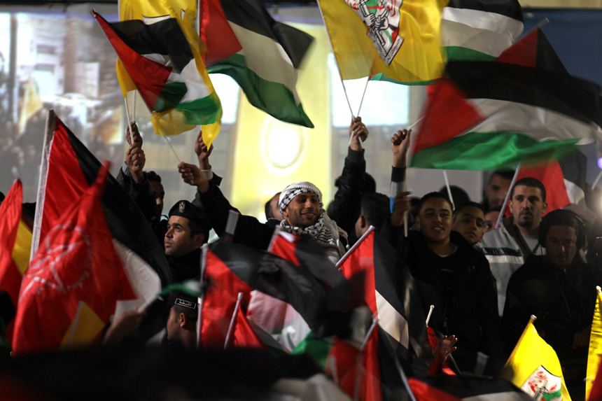 Palestinians celebrate in the West Bank city of Ramallah on November 29, 2012 after the General Assembly voted to recognise Palestine as a non-member state. The UN General Assembly on Thursday voted overwhelmingly to recognize Palestine as a non-member state, giving a major diplomatic triumph to president Mahmud Abbas despite fierce opposition from the United States and Israel.