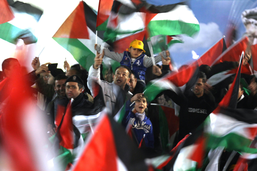 Palestinians celebrate in the West Bank city of Ramallah on November 29, 2012 after the General Assembly voted to recognise Palestine as a non-member state. The UN General Assembly on Thursday voted overwhelmingly to recognize Palestine as a non-member state, giving a major diplomatic triumph to president Mahmud Abbas despite fierce opposition from the United States and Israel. 