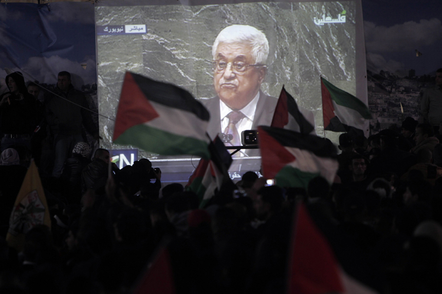 Palestinians watch on a giant screen Palestinian President Mahmoud Abbas speaking at the UN on November 29, 2012 in Ramallah. The UN General Assembly voted overwhelmingly to recognize Palestine as a non-member state, giving a major diplomatic triumph to president Mahmud Abbas despite fierce opposition from the United States and Israel. 