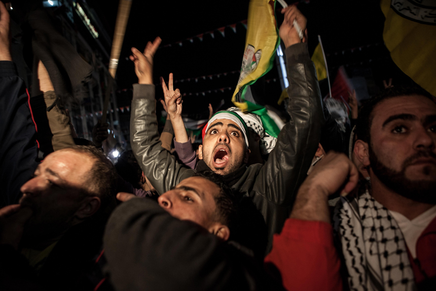 Palestinians celebrate in the West Bank city of Ramallah on November 29, 2012 after the General Assembly voted to recognise Palestine as a non-member state. The UN General Assembly on Thursday voted overwhelmingly to recognize Palestine as a non-member state, giving a major diplomatic triumph to president Mahmud Abbas despite fierce opposition from the United States and Israel.