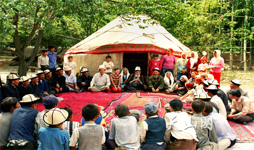 Yusup Mamai (C), 94, is the only living Manaschi, a singer of the Kirgiz 'Epic of Manas,' who can rhythmically chant the entire epic poem from beginning to end from memory.