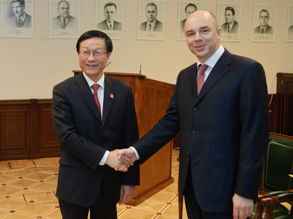 Chinese Finance Minister Xie Xuren (L) meets with his Russian counterpart Anton Siluanov before the Fourth Russia-China Finance Ministerial Dialogue in Moscow on Dec. 3, 2012. 