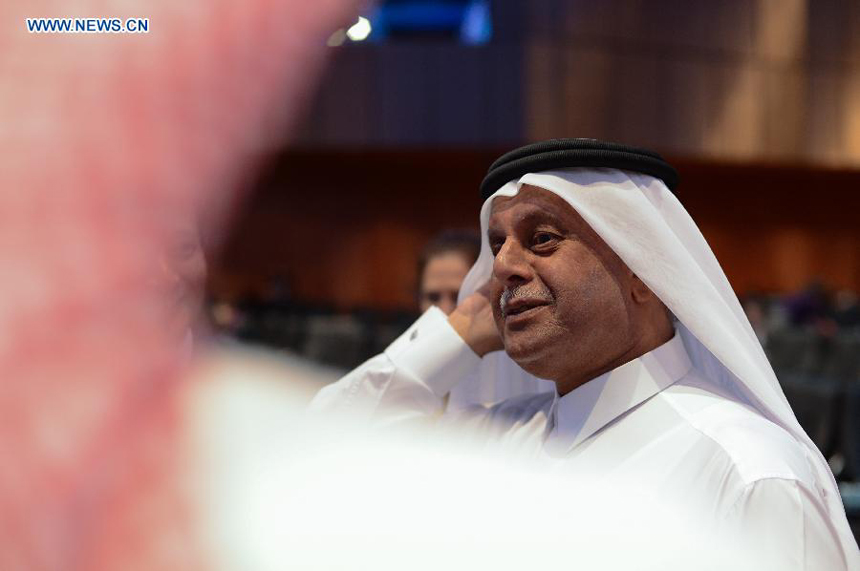 Abdullah Bin Hamad Al Attiyah, president of the 18th Conference of the Parties (COP18) to the United Nations Framework Convention on Climate Change (UNFCCC), is seen at the main conference hall on the extension day of UN climate talks in Qatar National Convention Center in Doha, Qatar, Dec. 8, 2012.