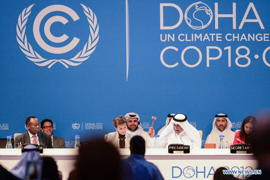 H.E. Abdullah Bin Hamad Al Attiyah (2nd R, front), President of the conference announces the final agreements of the UN Climate Change Conference (COP 18 and CMP 8) at the Qatar National Convention Center (QNCC) in Doha, Qatar, Dec. 8, 2012. [Xinhua]     