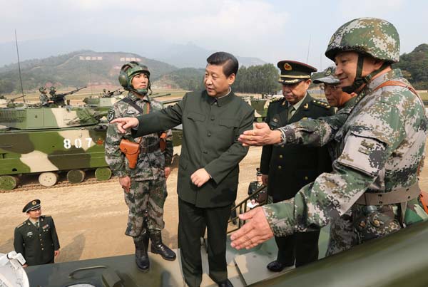 Xi Jinping, general secretary of the Communist Party of China Central Committee and chairman of the CPC Central Military Commission, inspects PLA units in Guangdong province on Monday. Xi ordered the PLA to intensify its combat awareness in order to sustain military readiness. [Photo/Xinhua] 