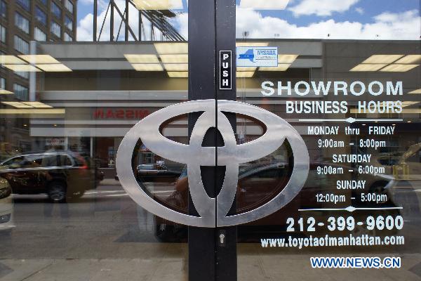 The Toyota logo is seen on the door at a dealership in New York, the United States, July 1, 2010.  Toyota has agreed to pay 17.35 million U.S. dollars in fines for its delayed recall of 154,000 Lexus SUVs over pedal entrapment issues. [Photo/Xinhua]