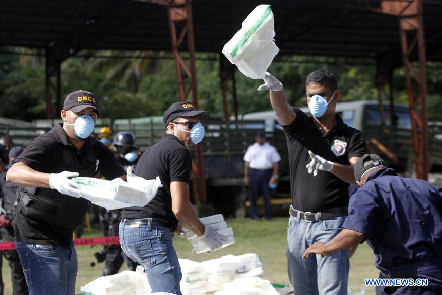 Members of the National Drug Control (DNCD, for it&apos;s acronym in Spanish) of the Dominican Republic participate in a drug burning at the Pedro Brand municipality, in Santo Domingo, Dominican Republic, on Dec. 20, 2012. According to the DNCD, 3,240 kg of pure cocaine, 325 kg and 766 marijuana plants, 15 kg of heroin and 4 kg of crack were burned on Thursday. The drugs were seized in the past five months in Santo Domingo.