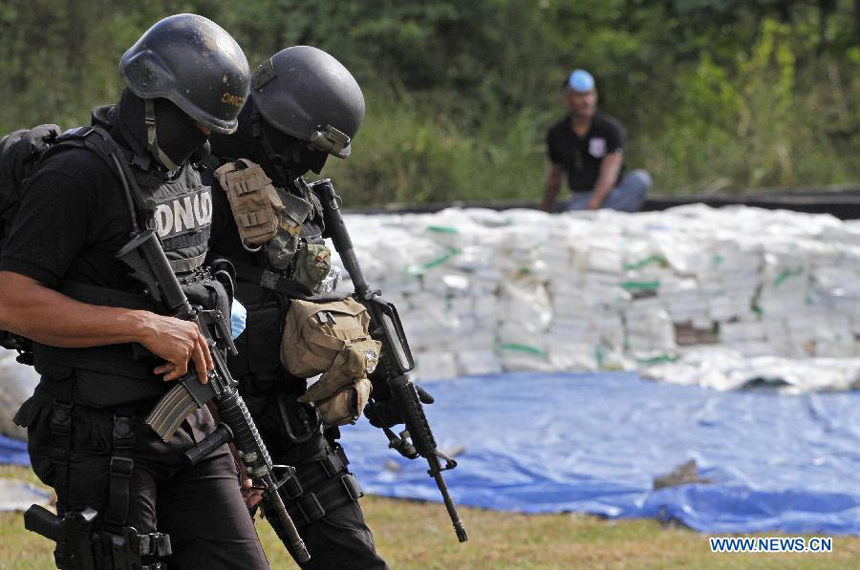 Members of the National Drug Control (DNCD, for it&apos;s acronym in Spanish) of the Dominican Republic participate in a drug burning at the Pedro Brand municipality, in Santo Domingo, Dominican Republic, on Dec. 20, 2012. According to the DNCD, 3,240 kg of pure cocaine, 325 kg and 766 marijuana plants, 15 kg of heroin and 4 kg of crack were burned on Thursday. The drugs were seized in the past five months in Santo Domingo.