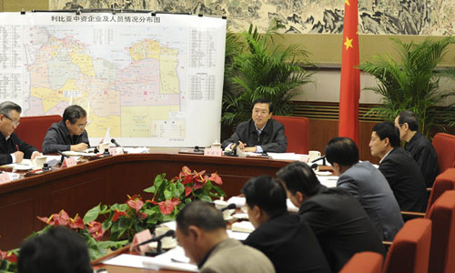 File photo taken on Feb. 26, 2011 shows Zhang Dejiang (C) holds a meeting to organize the evacuation of Chinese nationals in Libya and ensure their safety. [Photo/Xinhua] 