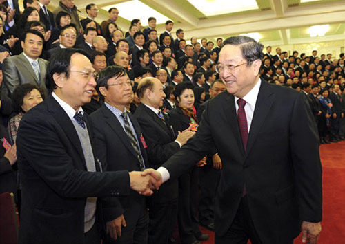 File photo taken on Dec. 6, 2012 shows Yu Zhengsheng (R, front) meets with delegates to the 15th National Congress of the Chinese Peasants and Workers Democratic Party (CPWDP) in Beijing, capital of China. [Photo/Xinhua]