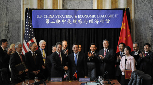 File photo taken on May 10, 2011 shows Wang Qishan (C) attends a signing ceremony of the 3rd round China-U.S. Strategic and Economic Dialogue. [Photo/Xinhua]