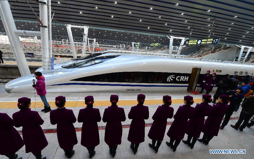 Bullet train G801 is to leave the Beijing West Railway Station in Beijing, capital of China, for Guangzhou, capital of south China's Guangdong Province, Dec. 26, 2012. 