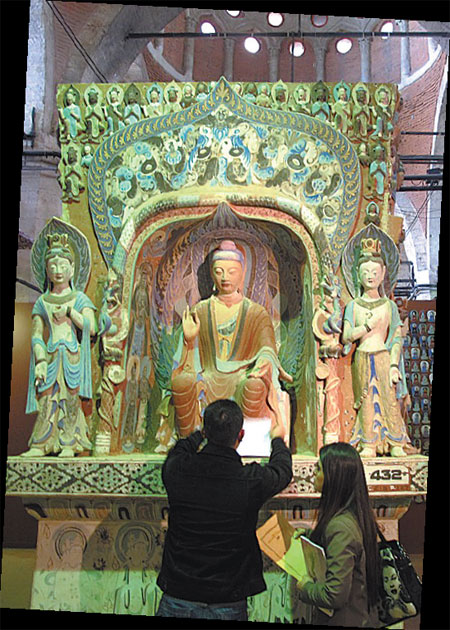 Visitors take a look at the Colors of Dunhuang exhibition, part of the Year of Chinese Culture in Turkey, at Tophane Armory of the Mimar Sinan University in Istanbul. Provided to China Daily
