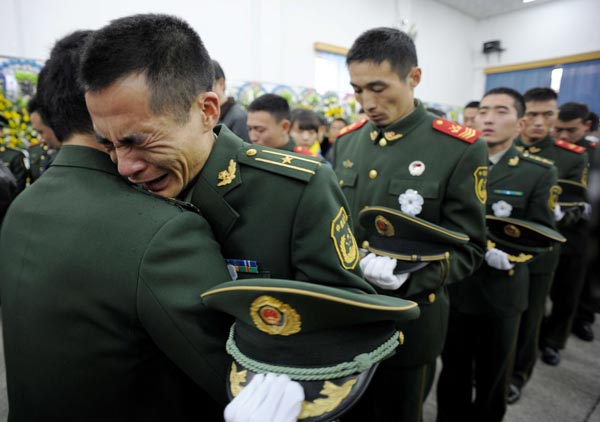 People gather to mourn fallen firefighters