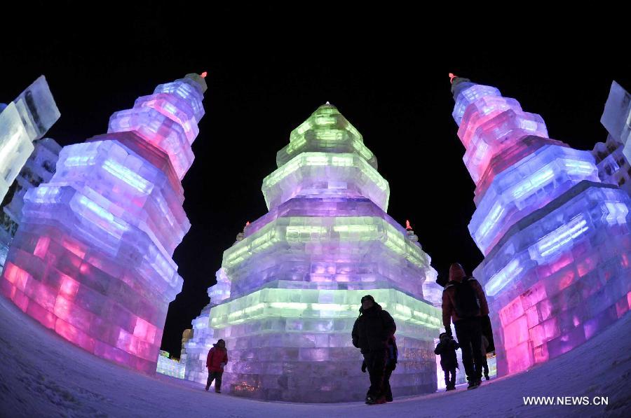 Visitors watch ice sculptures in the Ice and Snow World during the 29th Harbin International Ice and Snow Festival in Harbin, capital of northeast China's Heilongjiang Province, Jan. 5, 2013. The festival kicked off on Saturday.