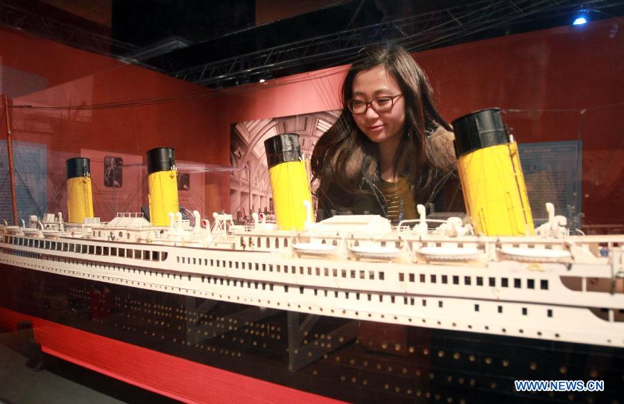 A visitor views a model of the passenger liner Titanic at a tour exhibition of Titanic artifacts in Shanghai, east China, Jan. 7, 2013. 