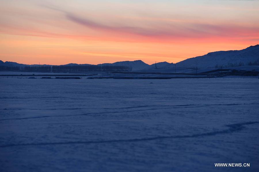 Photo taken on Jan. 8, 2013 shows the beautiful snow scenery of Qagan Gol Town in Qinghe County, northwest China's Xinjiang Uygur Autonomous Region.