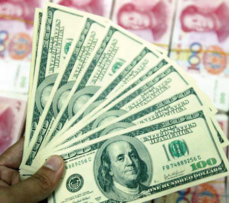 The yuan Wednesday touched the strongest level against the US dollar in 19 years in intraday trading but economists expect the rate to remain stable in the near term. [File Photo]