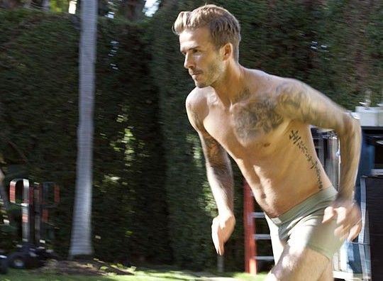 David Beckham runs topless through the streets. The soccer superstar is stripping down to just his underwear in a new campaign for HM's David Beckham Bodywear collection. [Photo:Sina.com]