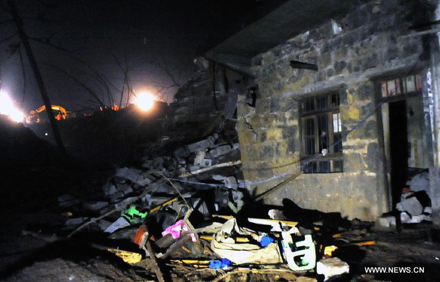 Photo taken on Jan. 11, 2013 shows a residential house at the landslide site at Gaopo Village in Zhenxiong County, southwest China&apos;s Yunnan Province.